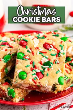 christmas cookie bars on a red plate with candy canes and sprinkles