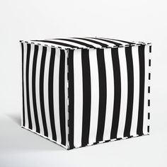 a black and white striped box sitting on top of a table