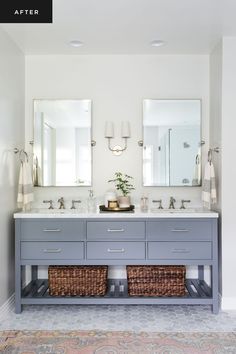 a bathroom with two sinks, mirrors and baskets on the counter top in front of it