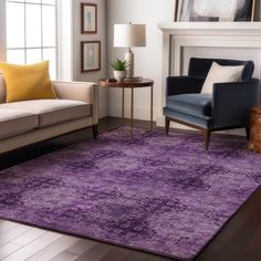 a living room with purple rugs and furniture