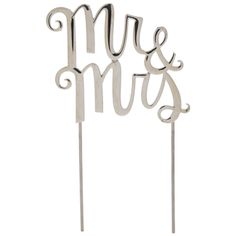 a cake topper with the word mr and mrs on it, in silver metal