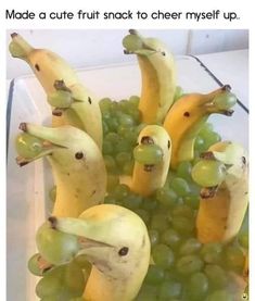 some bananas and grapes in a glass bowl