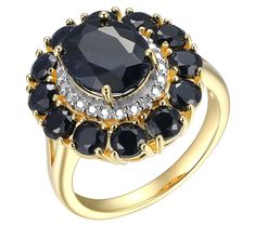 Elevate your style with this expertly crafted ring, a masterpiece of elegance in 18K gold-plated sterling silver. This bold halo ring showcases a stunning oval-cut black sapphire, encircled by sparkling diamond accents that lend a touch of sophistication to any outfit. From Affinity Gems. Elegant Black Cluster Ring For Formal Occasions, Elegant Black Cluster Ring For Formal Events, Black Oval Cluster Ring For Anniversary, Elegant Gold Diamond Ring With Black Diamonds, Luxury Black Sapphire Ring With Center Stone, Elegant Black Halo Rings, Elegant Gold Rings With Black Diamonds, Black Sapphire, Sparkling Diamond