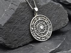 Zodiac Wheel Necklace made of Solid 925 Sterling Silver ☞ made to last.Matching Ring & Earrings ☞ please ask meDetails:• Silver Zodiac Pendant• Dimensions: Pendant Height 30mm, Width 23mm• Free Complimentary Chain• Solid 925 Sterling SilverSKU TE-037 Zodiac Sign Round Amulet Jewelry, Spiritual Zodiac Sign Round Jewelry, Spiritual Zodiac Sign Jewelry, Silver Zodiac Sign Amulet Jewelry, Sterling Silver Zodiac Sign Pendant, Zodiac Sign Sterling Silver Pendant, Sterling Silver Zodiac Pendant Jewelry, Sterling Silver Zodiac Sign Jewelry Gift, Sterling Silver Zodiac Sign Jewelry For Gift