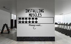 there is a gym with rows of exercise equipment in the background and an installing muscles sign on the wall