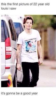 the man is walking down the street with his hand in his pocket and wearing a t - shirt that says, it's gone be a good year