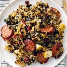 a white plate topped with sausage and rice