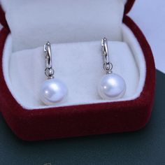 White 11-12mm Freshwater Pearl Earrings Stand out in these exquisite Freshwater Pearl & Classic Hoops Earrings. House of Pearls-JT crafted this perfect combination of 11-12mm Freshwater Pearl & Good Hoops Earrings and classic hoops for an elegant addition to your look. These earrings will be sure to bring that special sparkle to any outfit. Whether you're dressing up for an evening out or a casual day, these earrings are the perfect accessory for any occasion. Add this timeless piece to your col Classic White Gold Clip-on Earrings, Classic White Gold Clip-on Earrings For Formal Occasions, Luxury White Gold Round Clip-on Earrings, Classic White Round Cut Pearl Earrings, Classic White Gold Bridal Drop Earrings, Classic White Pearl Earrings, Hypoallergenic Round Pearl Earrings For Formal Occasions, Elegant White Gold Round Hoop Earrings, Classic Single Round Clip-on Earring