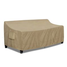 an outdoor furniture cover on top of a couch