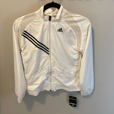 Very Light Windbreaker With Front Zipper Pockets. Small Stain On Back (See Picture) Nwt! Adidas White Athleisure Track Jacket, White Fitted Track Jacket For Sports, Fitted White Track Jacket For Sports, White Casual Track Jacket For Fall, White Long Sleeve Sports Track Jacket, Sporty White Fall Outerwear, White Outerwear For Fall Sports, Sporty White Outerwear For Fall, Adidas White Athleisure Outerwear