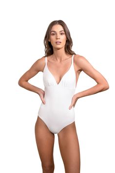 Our Catherine one piece in white is the perfect body con swimsuit. This swimsuit is also great as a bodysuit. Wear it with shorts, pants, and skirts for the perfect look. Made in America. 85% Nylon / 15 % Spandex. Elegant White Swimwear With Built-in Bra, Elegant Bodysuit With Built-in Bra For Vacation, Summer Solid Shapewear Leotard, White Stretch One-piece Bodysuit, Chic Bodysuit With Built-in Bra For Pool, One-piece Elastane Bodysuit For The Beach, One-piece Elastane Bodysuit For Pool, White Lined Bodysuit For Pool, White Lined Swimwear For Pool