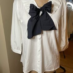 Cute Milk & Honey Bow Tie Blouse In Black And White. Bow Can Be Untied To Tie However Suits The Outfit. 3/4 Length Sleeve And Flowy Unstructured Fit. Never Worn Great Condition Chic White Blouse With Bow Detail, Chic White Blouse With Bow, White Bow Blouse For Workwear, White Bow Blouse For Work, White Half Sleeve Office Blouse, White Half Sleeve Blouse For Office, White Bow Tops For Work, White Bow Top For Work, Spring Office Wear Blouse With Bow