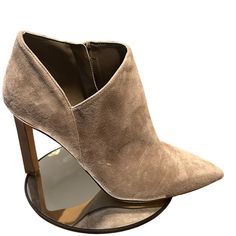 Strut Your Style In The Selsta Bootie From Vince Camuto. This Bootie In An Ankle-Fitted Silhouette With A Split, Tulip Topline. A Skinny Heel Elevates The Appearance. Suede & Embossed Leather Upper Inside Zipper Closure Pointed Toe Fabric Lining Approx. 2¾" Shaft Height Approx. 12" Calf Circumference 3½" Covered Heel Rubber Sole Imported Pointed Toe Heeled Boots With Suede Lining, Fitted Boots With Suede Lining And Pointed Toe, Suede Lined Pointed Toe Work Boots, Pointed Toe Suede Lined Work Boots, Pointed Toe Workwear Boots With Suede Lining, Pointed Toe Boots With Suede Lining For Work, Chic Pointed Toe Heeled Boots With Heel Tab, Workwear Boots With Suede Lining And Pointed Toe, Fitted Heeled Boots With Suede Lining And Almond Toe