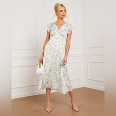 - Ruffled Short Sleeves - V-Neckline - Floral Print - Midi Length - Back Tie Detail - Self: 98% Polyester 2% Spandex, Lining: 100% Polyester White Midi V-neck Dress For Spring, Chic White V-neck Dress With Floral Print, White Maxi Length V-neck Dress For Spring, White V-neck Dress For Spring Garden Party, White V-neck Surplice Neckline Dress For Brunch, White V-neck Dress For Garden Party In Spring, Feminine White V-neck Dress For Spring, White Floral Print V-neck Dress For Spring, White V-neck Midi Dress For Spring