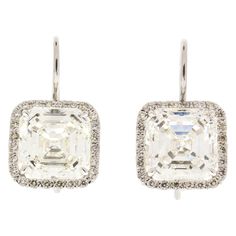 These earrings were made for the most sophisticated woman. 2 EGLUSA certified square emeralds totaling 10.04 carats are set to hang magnificently. They are near colorless and VS2 in purity. 0.48 carats of round brilliant cut precisely frame each diamond, creating the wonderful contrast between antique step cut and modern brilliant cut. Handcrafted in 18K white gold, they are certified and appraised for $243,000. Emerald Cut Diamond Earrings, Vintage Drop Earrings, Asscher Cut Diamond, Step Cut, Asscher Cut, Silver Feather, Expensive Jewelry, Diamond Drop Earrings, Diamond Drops