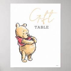 a winnie the pooh poster is displayed on a white background with an orange lettering that reads, gift table