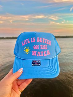 This adjustable OTTO trucker hat is so cute for summer time, it is adjustable and super comfy! It reads “Life is better on the water” in pink vinyl with a sunshine detail!! 🫶 Blue Trucker Hat, Ocean Inspired Jewelry, Pink Vinyl, Custom Trucker Hats, Hat Patches, Hat Ideas, Neat Ideas, Ocean Inspired, Inspired Jewelry