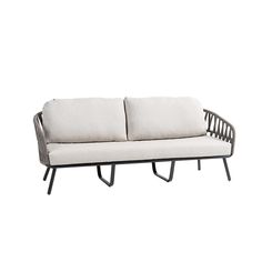 a white couch sitting on top of a metal frame