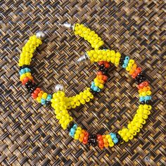 Seed Bead Earrings. Never Worn. Yellow, Black, Turquoise, Orange And Red Beads Yellow Round Earrings For Beach, Yellow Tiny Beads Round Jewelry, Yellow Beaded Earrings With Ear Wire For Festivals, Yellow Round Beaded Jewelry, Yellow Jewelry With Tiny Round Beads, Handmade Vibrant Yellow Jewelry, Yellow Bohemian Hoop Earrings For Beach, Bohemian Yellow Hoop Earrings For Beach, Vibrant Handmade Yellow Jewelry