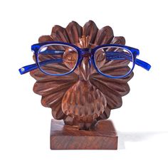 The eyeglass holder, featured in a playful peacock shape will add a uniquely interesting piece to your home. Place glasses over the friendly little peacocks eyes and secure in notch for stylish safekeeping. Art Forms Of India, Eyeglass Holder Stand, Computer Literacy, Glasses Holder, Sunglass Holder, Eyeglass Holder, Glass Holders, Eye Wear Glasses, Handcrafted Wood