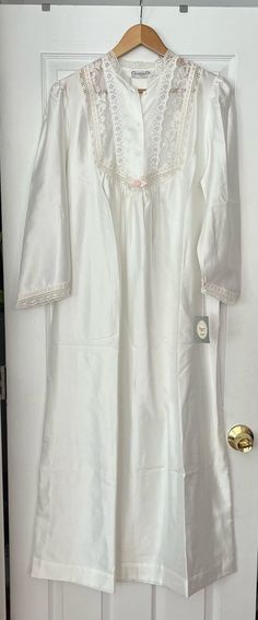 Christian Dior Nightgown Union Made Lingerie lace Prairie Vintage Size Small long nightgown Union Made New With Tags Lingerie lace Prairie White with white lace trim pink ribbons and lace RN# 14242 Union Made - International ladies workers garment union Made in the USA style 38088 lot 4083 80 % polyester 20 % cotton Thanks for looking ! Dior Nightgown, Long Nightgown, Vintage Christian Dior, Women's Nightgowns, Pajama Robe, Union Made, Nightgowns, Lingerie Lace, Night Gown