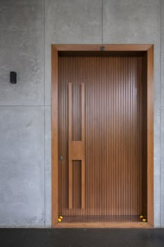 an open wooden door on the side of a building