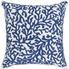 a blue and white pillow with an intricate design on the front, featuring corals