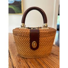 This Woven Purse Is A Must-Have For Any Fashion-Forward Woman. The Satchel/Top Handle Bag Style Is Perfect For A Day Out Or A Night On The Town. The Exterior Is Made Of Straw In A Beautiful Brown Color, While The Lining Also Features A Light Canvas Color. The Double Handles Are Made Of Leather, Adding A Touch Of Luxury To This Satchel. The Purse Is Medium-Sized And Perfect For Carrying All Your Essentials. The Pattern Is Woven, Adding A Unique Touch To The Bag. This Purse Is A Great Addition To Old Money Minimalist, Metal Joints, Money Minimalist, Basket Purse, Nantucket Style, Nantucket Baskets, Woven Purse, Wicker Purse, Lighted Canvas