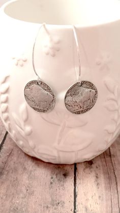 Stunning buffalo coin earrings! The sterling silver plated ear wires measure 1 2/5", and the pewter buffalo charms measure 4/5" x 4/5" (Total length is approximately 2 1/5") All items are lead and nickel free, message with any questions, thanks! Sterling Silver Etched Coin Jewelry, Etched Sterling Silver Coin Jewelry, Etched Coin-shaped Sterling Silver Jewelry, Adjustable Stamped Dangle Earrings, Nickel-free Southwestern Metal Jewelry, Silver Concho Metal Jewelry, Nickel Free Coin Shaped Sterling Silver Earrings, Nickel Free Coin-shaped Sterling Silver Earrings, Nickel Free Sterling Silver Coin Earrings