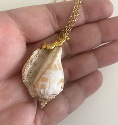 "Hand painted seashell  Gold painted accents. Mermaid charm pendant. 24\" Chain Shell is 1.5\" long. Shells have imperfections not a smooth surface.  They have been tumbled by the waves. Gift box is included. Custom orders welcomed. Free shipping within the USA USA Seller" Shell-shaped Charm Necklaces Made Of Shell As Gift, Shell Charm Necklace As A Gift, White Shell Charm Necklace As Gift, Shell Pendant Charm Necklaces For Gifts, White Shell Charm Necklace Gift, White Shell Charm Necklace For Gift, Shell Charm Necklaces As Gift, Shell Shape Charm Necklace As A Gift, Pendant Shell Necklace With Lobster Clasp As Gift