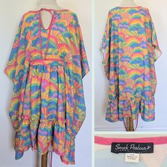 This Smak Parlor caftan has a beautiful Peter-Max-style print. The colors are vibrant. It has inner ties so it can accomodate many sizes. Great for a summer party. A stylish, unconventional (but awesome) choice for a pregnant person. Wear with tall brown boots, flip flops etc. Smak Parlour Psychadelic print caftan - Inner ties accomodate multiple sizes (Great for a pregnant person) - Wear with tall brown or white boots, or strappy gold or brown sandals *Not vintage bt does have a vintage style p Casual Multicolor Flowy Kaftan, Casual Multicolor Boho Print Kaftan, Rainbow Print Beach Dress, Beach Dresses With Rainbow Print, Colorful Rainbow Print Beach Dress, Casual Multicolor Kaftan With Vibrant Print, Multicolor Bohemian Dresses For Summer Parties, Bohemian Multicolor Dress For Summer Parties, Multicolor Retro Beach Dress