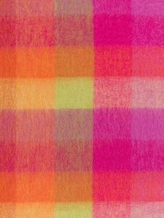 an orange, pink and green plaid pattern is seen in this image with no background