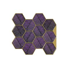 an embroidered patch in purple and gold with hexagons on the back side