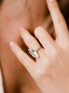 a close up of a person wearing a ring