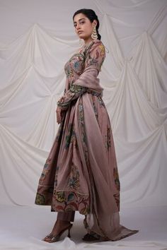 Sand rose pink pleated anarkali with all over peacock, floral kalamkari pattern. Paired with a pant and dupatta with kalamkari border. - Aza Fashions Kalamkari Print Anarkali Set For Wedding, Pink Silk Long Sleeve Anarkali Set, Pink Dress With Printed Motifs And Traditional Drape, Pink Long Sleeve Silk Anarkali Set, Long Sleeve Pink Silk Anarkali Set, Pink Sharara With Printed Motifs And Traditional Drape, Pink Silk Anarkali Set For Transitional Season, Pink Anarkali Set With Printed Motifs For Festive Occasion, Festive Pink Anarkali Set With Printed Motifs