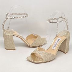 Never Worn With Box And Dust Bag. Size 35.5 Retail For $1150 Made In Italy, These Saeda Glitter Sandals From Jimmy Choo Are Styled With An Open Toe And A Crystal Charms At The Ankle. Open Toe Clasp Closure Textile Upper Leather Sole Made In Italy Block Heel: About 3.25” (85mm) Luxury Sparkling Open Toe Heels, Elegant Glitter Wedding Shoes With Block Heel, Luxury Open Toe Sparkling Sandals, Luxury Sparkling Open Toe Sandals, Luxury High Heel Sparkling Sandals, Luxury Sparkling High Heel Sandals, Elegant Glitter Block Heel Sandals, Elegant Glitter Sandals With Block Heel, Luxury Sparkling Sandals For Gala