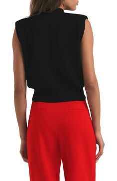 Whether layered or worn solo, this slightly cropped knit top is a stylish standby for any day of the week. 21" length (size Medium) Mock neck Sleeveless 85% acrylic, 15% nylon Dry clean Imported Black Knit Vest For Workwear, Casual Cropped Vest For Work, Black Knit Vest For Work, Chic Viscose Knit Top For Layering, Chic Cropped Knit Top For Layering, Cropped Tank Top For Layering, Chic Cropped Knit Top, Chic Cropped Sweater Vest For Fall, Knit Crop Top For Layering