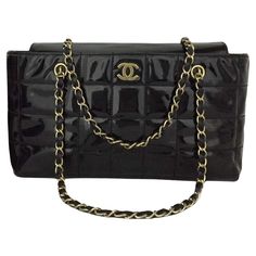 Classic Chanel Black Enamel Shoulder Bag. Leather Chicklet Design. Vintage Chanel with gold color accents. CC in the front of the bag. Leather and gold straps. The interior of the bag is leather and has separating compartments. The interior has a wonderful CC print fabric. The interior has a leather badge that has Chanel Italy Imprinted/Stamped on the leather. This bag measures approx. - 12.75w x 7h x 3.5d This bag measures approx. - 12.75w x 7h x 3.5d No box is included in this listing. Pink Chanel Flap, Vintage Chanel Bag, Classic Chanel, Chanel Boutique, Chanel Collection, Classic Flap Bag, Color Accents, Pink Chanel, Pink Handbags