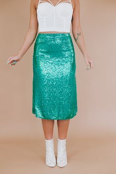 The More Of Glam Sequin Skirt offers a statement-centered look with sequin detailing throughout and an elevating midi length. Display a sleek, polished look in this midi skirt. Waist: High Rise Fabric: 95% Polyester, 5% Spandex; Lining: 100% Polyester Fully sequin design throughout Lined Midi length Imported Fit: True to size MEASUREMENTS: Measured laying flat: 1” stretch throughoutS: WAIST: 26” | LENGTH: 29” | HIPS: 36”M: WAIST: 28” | LENGTH: 29” | HIPS: 38”L: WAIST: 30” | LENGTH: 29 1/2” | HIP Sequin Design, Everyday Chic, Sequin Top, Bottom Clothes, Chic Boutique, Displaying Collections, Polished Look, Midi Length, Sequin Skirt