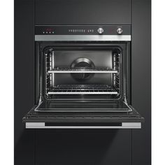 an oven with its door open and the light on in it's right hand corner