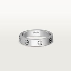 Cartier - LOVE wedding band, 1 diamond - Ring White gold/Diamond - LOVE wedding band, 18K white gold (750/1000), set with 1 brilliant-cut diamond totaling 0.02 carats. Width: 4 mm (for size 52). Please note that the carat weight, number of stones and product dimensions will vary based on the size of the creation you order. For detailed information please contact us. Single Diamond Anniversary Bands, Anniversary Bands With Single Diamond, Anniversary Diamond Band With Single Diamond, Modern Cartier Diamond Rings, Cartier White Gold Promise Ring, Cartier White Gold Diamond Promise Ring, Cartier Diamond Rings For Anniversary, Cartier Diamond Promise Jewelry, Cartier Diamond Jewelry For Promise