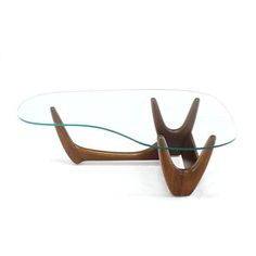 a glass and wood coffee table with curved legs