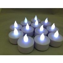 white tealight candles are arranged in a circle