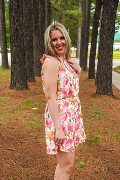 Nothing more rare than a dress that is comfortable AND looks amazing on you! This Rare Love Floral Dress is exactly that! From the bright floral print to the elastic waist and faux halter looking dress. This dress screams summer go to and we are 100% on board with it! Anna is 5'6 and is wearing a size small. Pink Halter Dress For Summer Garden Party, Pink Summer Halter Dress For Garden Party, Floral Print Halter Sundress For Summer Parties, Spring Sundress With Elastic Waistband, Casual Pink Halter Dress For Summer, Summer Floral Print Halter Dress For Garden Party, Spring Beach Sundress With Elastic Waistband, Flowy Floral Print Halter Dress For Garden Party, Summer Halter Dress With Floral Print For Garden Party