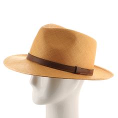 ↑ Click above to watch the video! ↑ Malta Sienna is a modern fedora with a tall hand-blocked teardrop crown that features a stiffened medium brim, sleek leather strap hatband, and beautiful sienna-colored straw. The brim contains a wire to hold its shape. This item is a genuine Panama Hat handwoven in Ecuador. Material: 100% Toquilla StrawBrim: 2 3/4"Crown: 4 1/2" teardropHatband: 5/8" leatherClimate: Sun Handwoven in Ecuador. Hand-finished in the US. Measurements are approximate, this is a hand Modern Wide Brim Fedora For Everyday, Modern Adjustable Brimmed Fedora, Modern Fedora With Short Brim For Everyday, Classic Brown Panama Hat For Formal Occasion, Classic Brown Formal Panama Hat, Modern Fedora With Adjustable Fit And Short Brim, Modern Adjustable Fedora With Short Brim, Classic Flat Brim Fedora For Travel, Modern Panama Hat With Short Brim For Spring