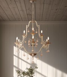 a chandelier hanging from the ceiling in a room