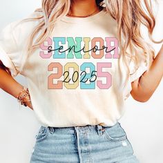 Comfort Colors® Senior 2025 Shirt, Class of 2025, High School Senior Year Matching Shirts, Trendy Highschool Senior Gifts, Senior Year Tee ABOUT: ⋒ The shirt used is the Comfort Colors® 1717 Unisex Garment-Dyed T-shirt ⋒ 100% ring-spun preshrunk US cotton ⋒ Medium fabric ⋒ Rolled sleeves in pictures is for styling purposes only ⋒ Props used in photos are NOT included with purchase SIZING: ⋒ Tees are UNISEX so please refer to sizing chart in photos ⋒ We recommend women to size down if between siz High School Senior Year, Highschool Senior, Senior Jeans, Shirts Trendy, Senior Gifts, Rolled Sleeves