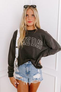 - Cheer on your team with this trendy 'GAME DAY' sweatshirt! Perfect for casual spirited moments, this cozy piece is an ideal option for putting a little pep in your step. - Unlined sweatshirt material - 'GAME DAY' lettering across the front - A crew cut neckline - Long, loose sleeves with ribbed cuffs - A relaxed silhouette that ends in a ribbed hemline - This piece is perfect for fans of Georgia, Texas Tech, Oklahoma State, Vanderbilt, Missouri, and more! Measurements S : Bust 44", Hip 44", Le Gray Sweatshirt For Game Day In Fall, Casual Gray Sweatshirt For Game Day, Everyday Fall Sweats With Letter Print, Varsity Tops For Everyday Fall Wear, Everyday Varsity Fall Tops, Everyday Fall Varsity Tops, Everyday French Terry Tops With Letter Print, Everyday Varsity Long Sleeve Sweatshirt, Everyday Long Sleeve Varsity Sweatshirt