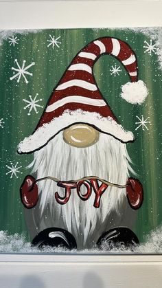 a painting of a santa clause hat with the word joy on it's face