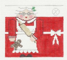 a cross stitch pattern with an image of a woman holding a knife and a teddy bear